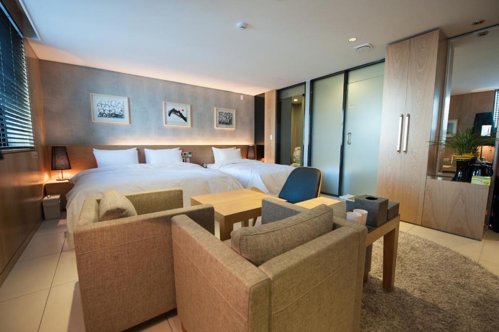 Postel nebo postele na pokoji v ubytování Rian Hotel