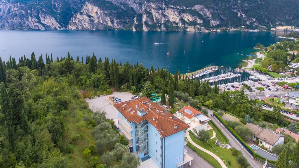 an aerial view of a building on the shore of a lake at Residence Marina in Riva del Garda