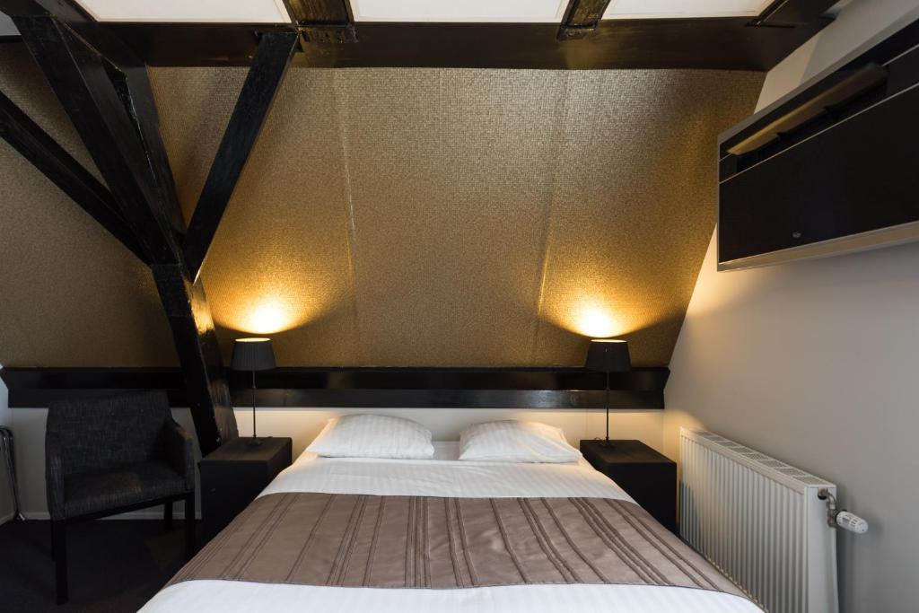 Postel nebo postele na pokoji v ubytování Hotel Zilt
