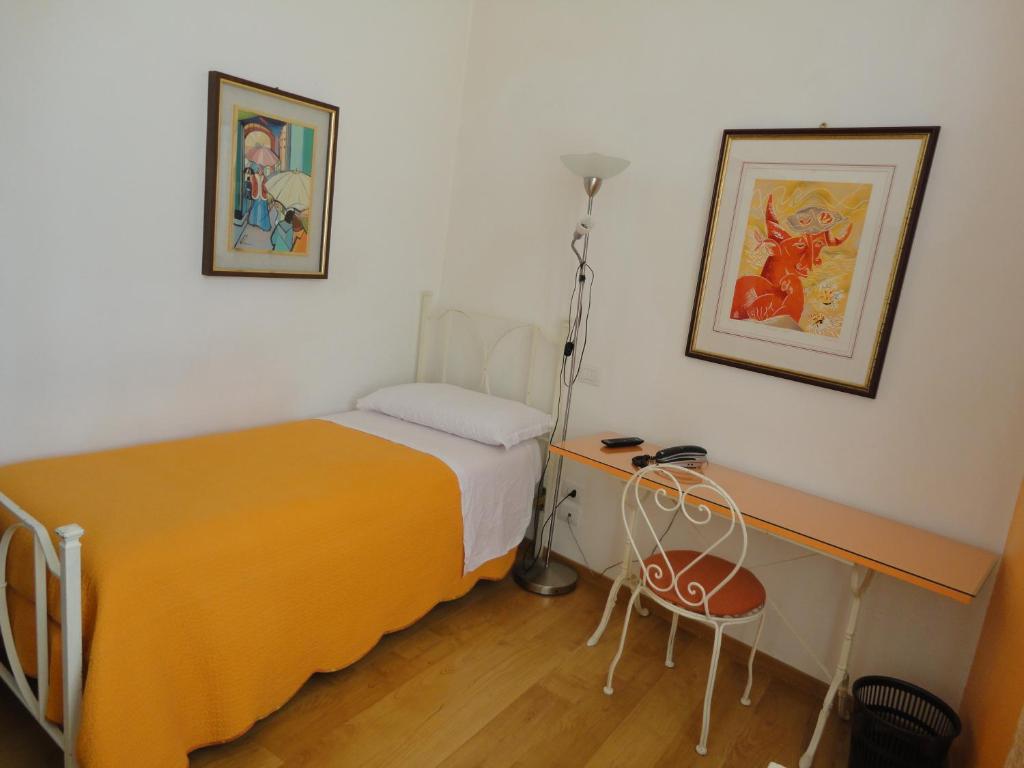Postel nebo postele na pokoji v ubytování Hotel Morlacchi