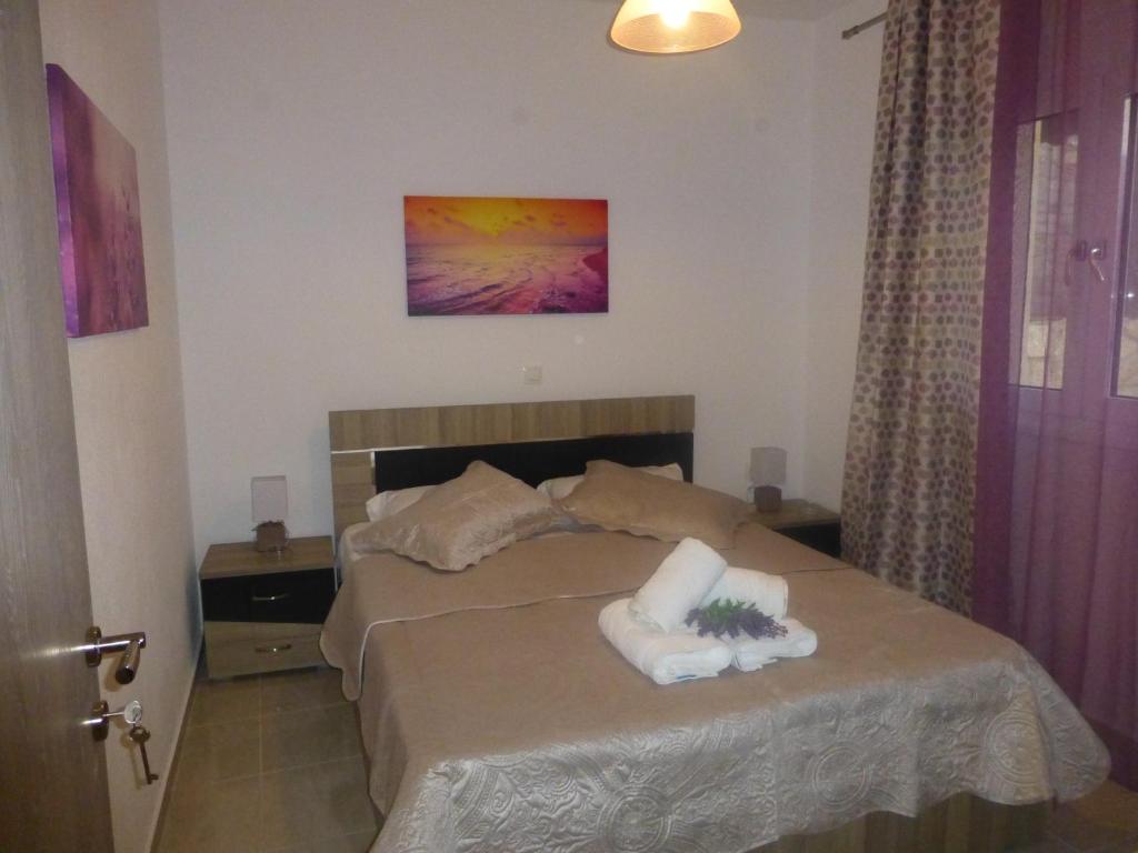 Postel nebo postele na pokoji v ubytování Pavloudis Apartments