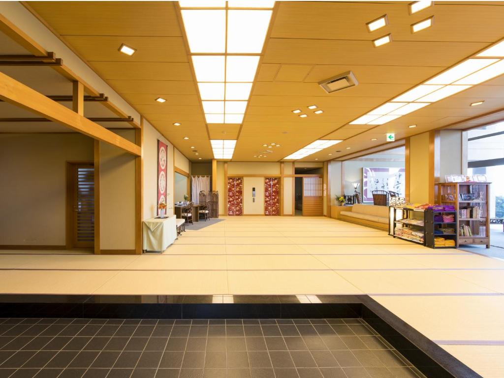 an empty lobby of a store with a large ceiling at Hakusen in Yonago