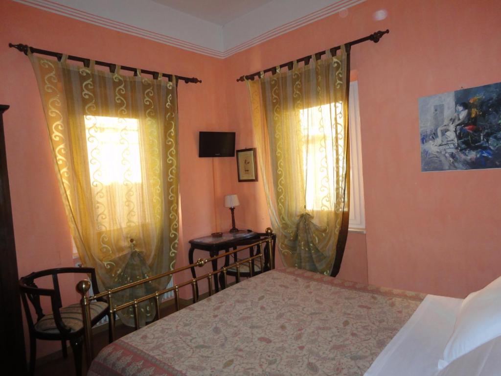 Postel nebo postele na pokoji v ubytování Hotel Morlacchi