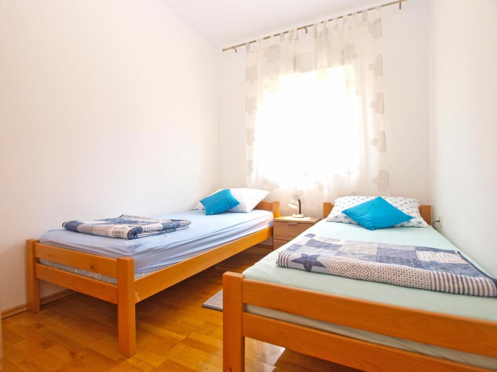Posteľ alebo postele v izbe v ubytovaní Apartments Stjepan 1573