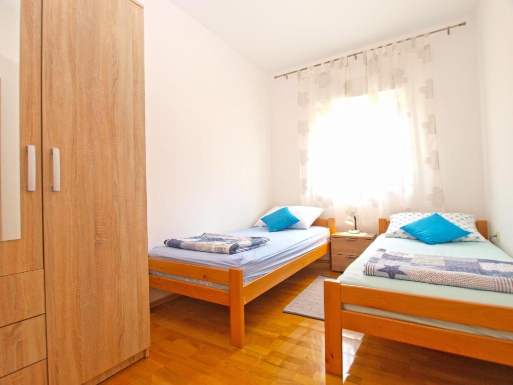 Posteľ alebo postele v izbe v ubytovaní Apartments Stjepan 1573
