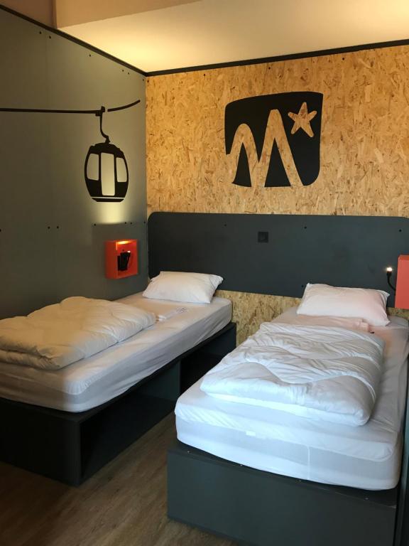 Postel nebo postele na pokoji v ubytování Moontain Hostel