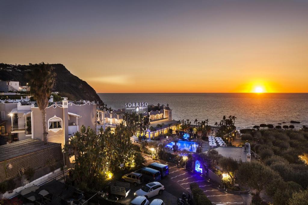 an aerial view of a villa with a sunset at Sorriso Thermae Resort & Spa in Ischia