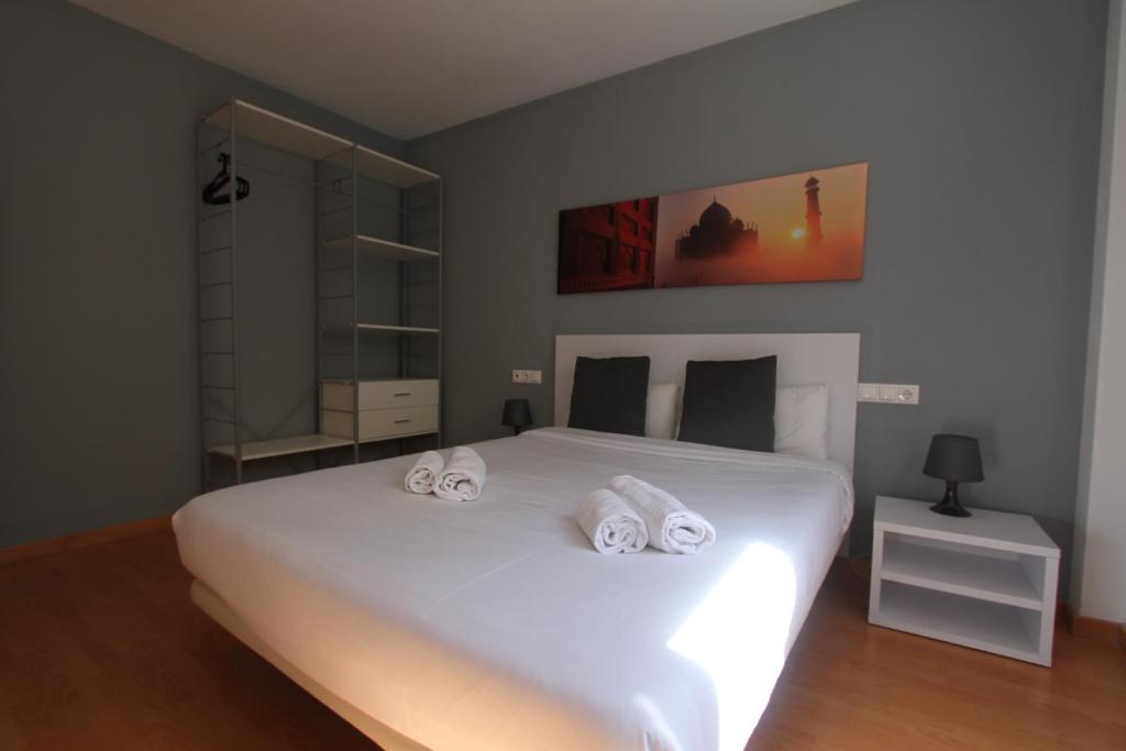 Posteľ alebo postele v izbe v ubytovaní For a Stay Las Dunas
