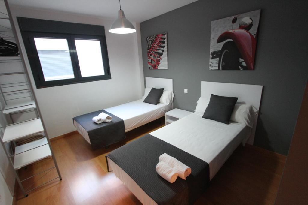 Posteľ alebo postele v izbe v ubytovaní For a Stay Las Dunas