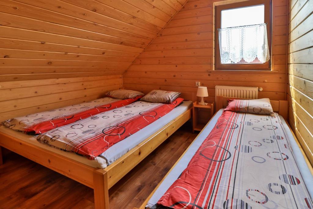 Postel nebo postele na pokoji v ubytování Domki w Istebnej