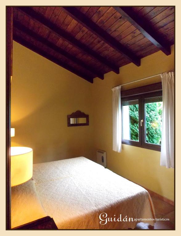 Postel nebo postele na pokoji v ubytování Apartamentos Guidan