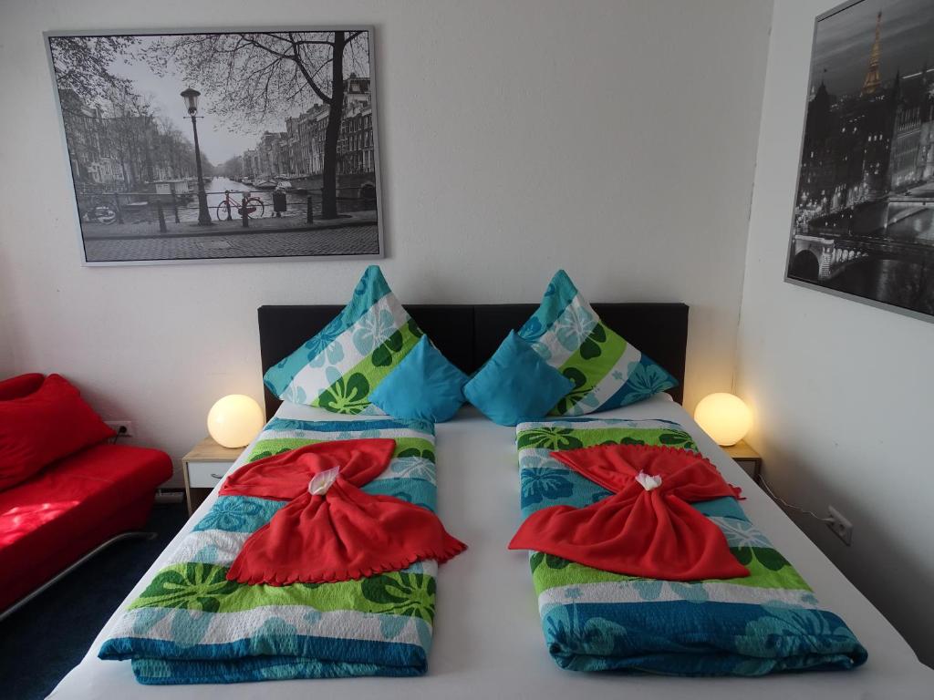 Кровать или кровати в номере Gästehaus Uezel