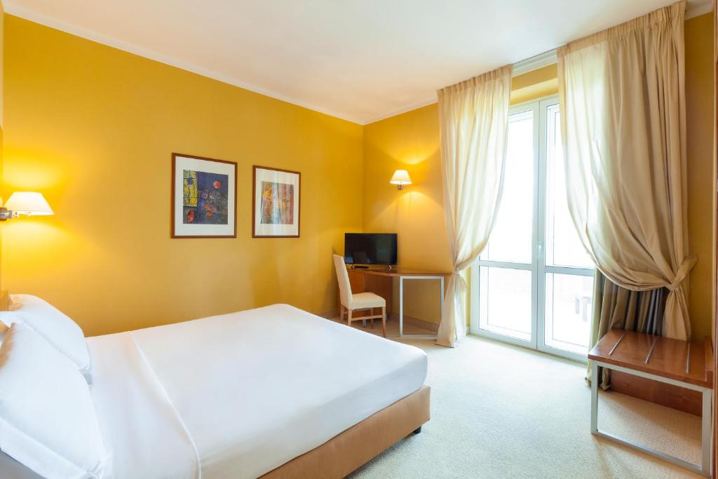 Postel nebo postele na pokoji v ubytování Ibis Styles Bari Giovinazzo
