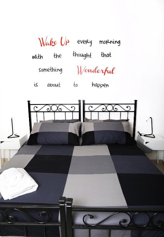 A bed or beds in a room at ImeraRooms