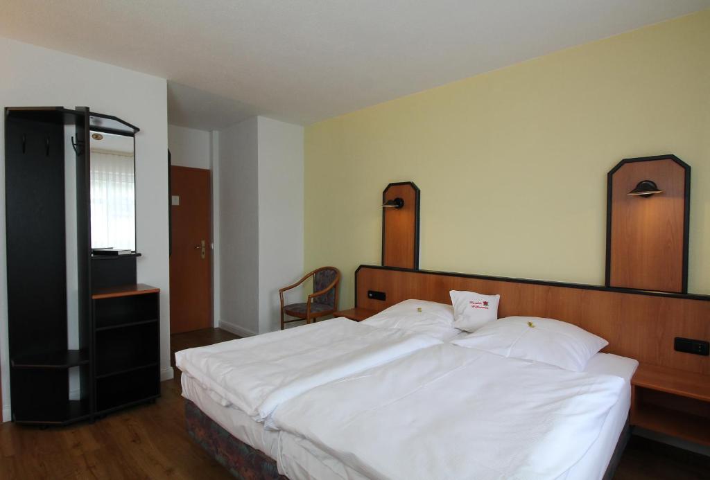 Katil atau katil-katil dalam bilik di Hotel & Restaurant am Rosenhügel