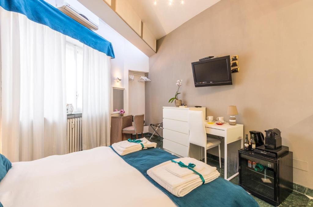 Łóżko lub łóżka w pokoju w obiekcie Trastevere Sweet House