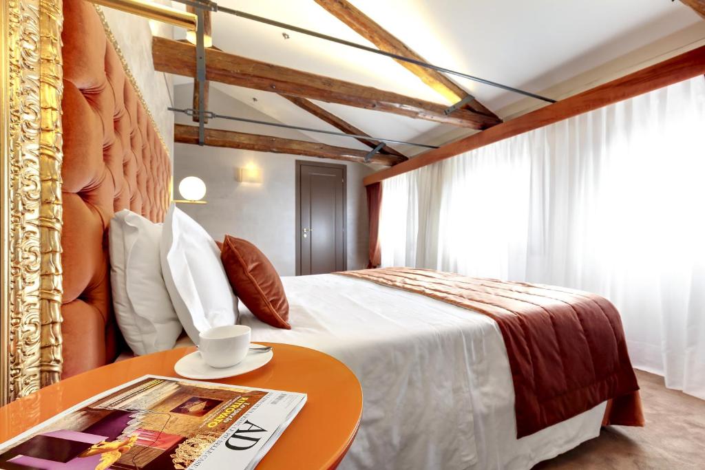 Postel nebo postele na pokoji v ubytování Hotel Donà Palace
