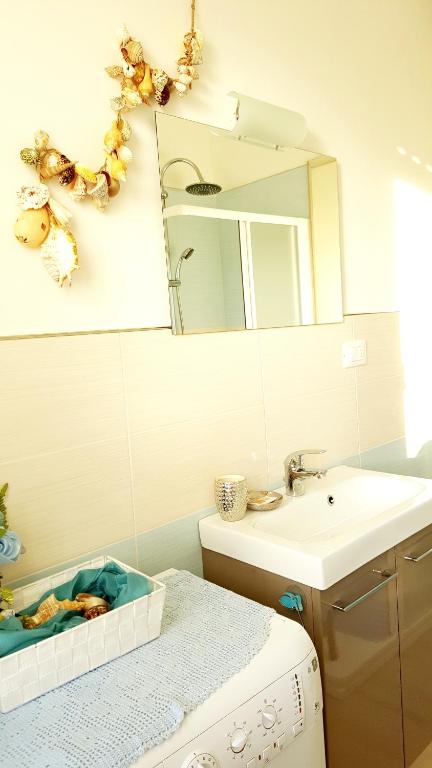 Kúpeľňa v ubytovaní Casa Vacanza Marina, in pieno centro a pochi passi dal mare e con aria condizionata!