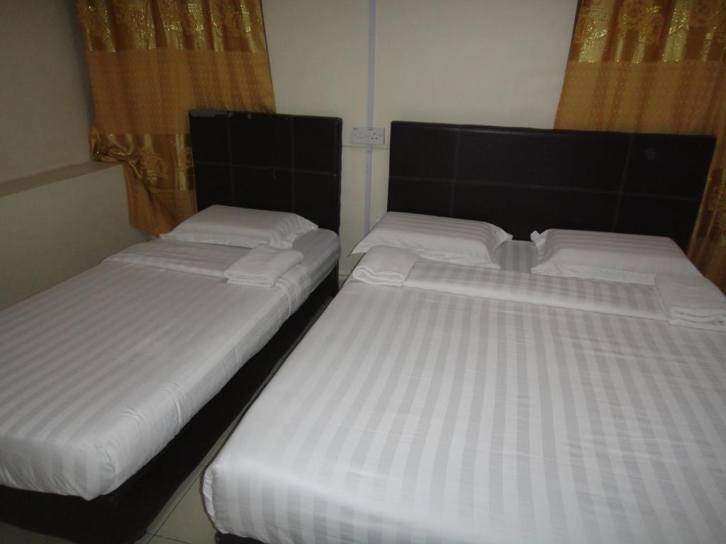 Postel nebo postele na pokoji v ubytování Hotel Ocean