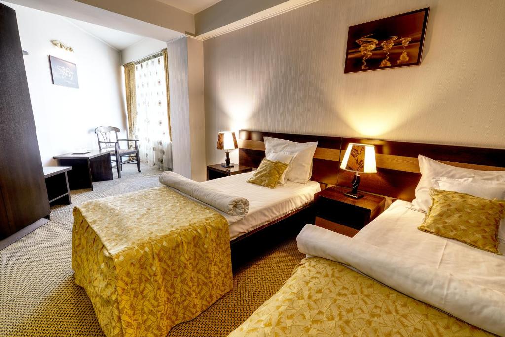Indiana Hotel tesisinde bir odada yatak veya yataklar