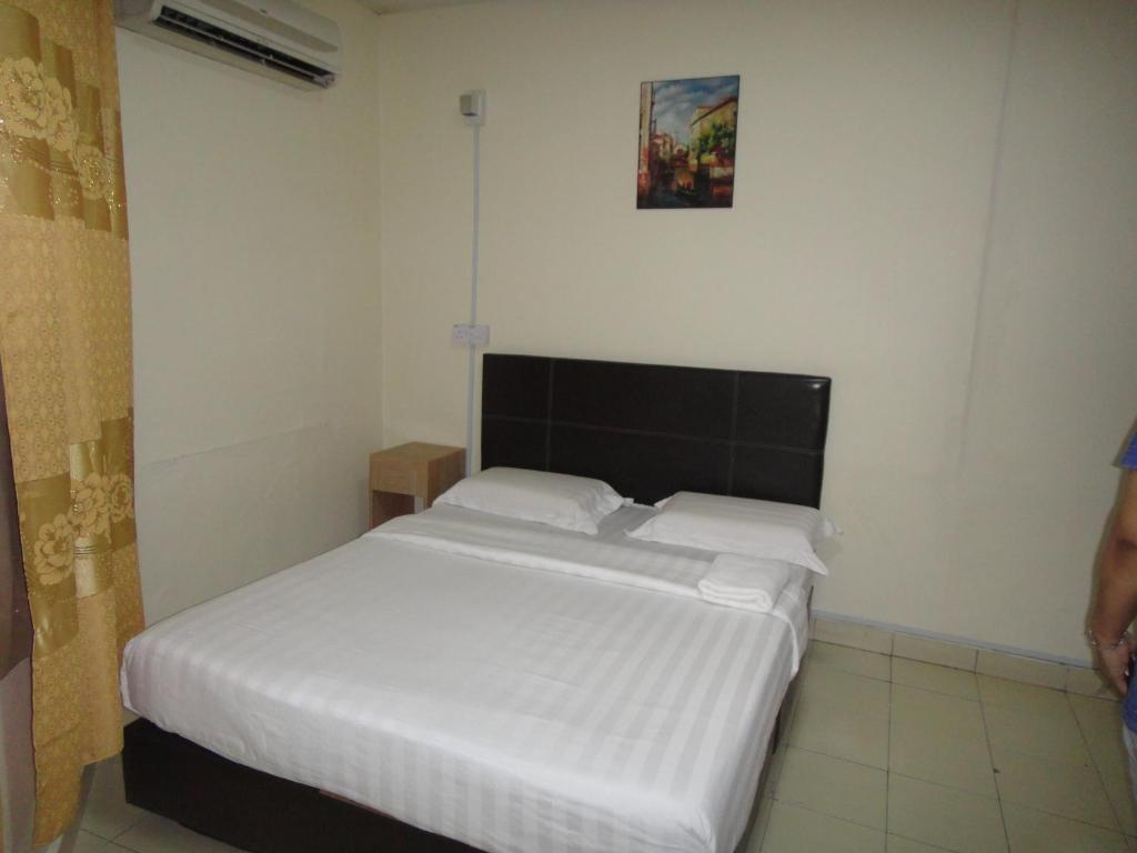 Postel nebo postele na pokoji v ubytování Hotel Ocean