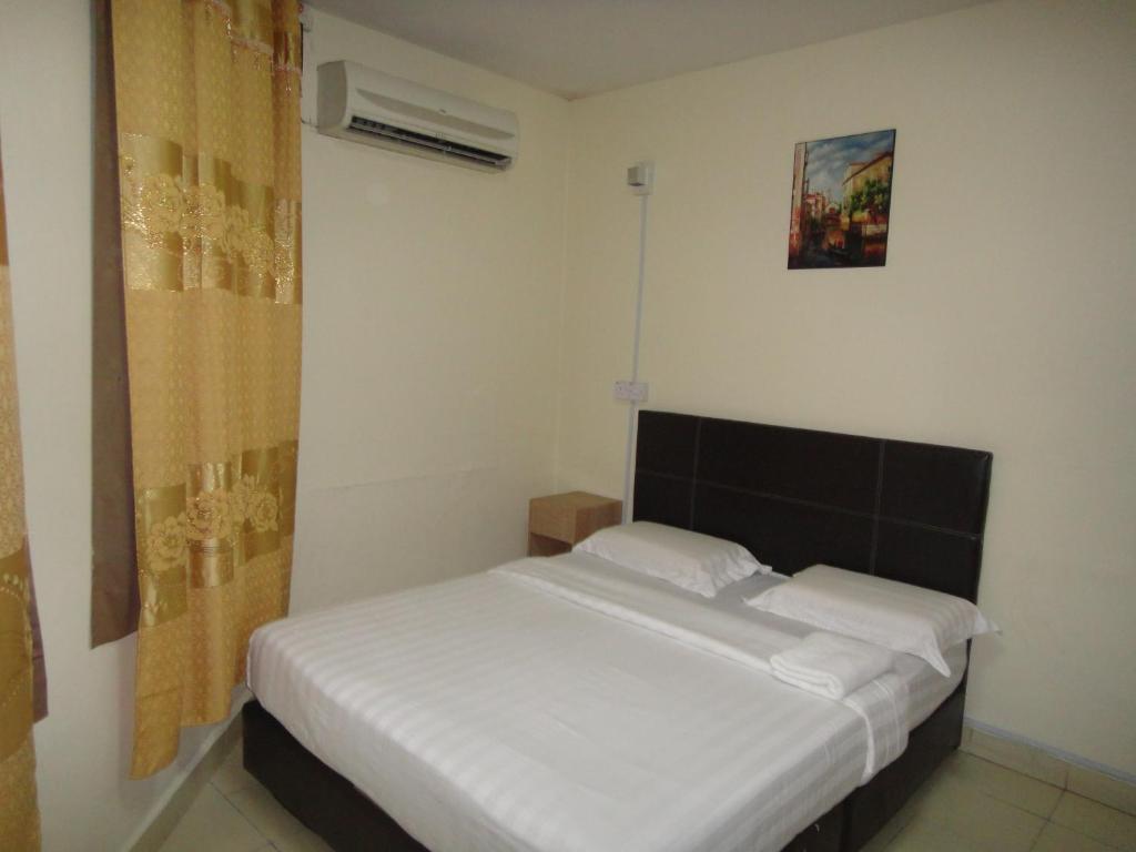 Postel nebo postele na pokoji v ubytování Hotel Ocean