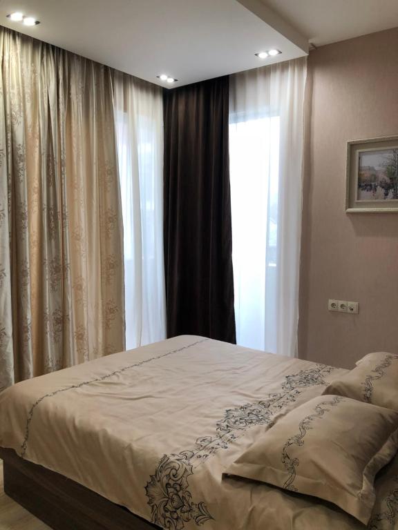 Postel nebo postele na pokoji v ubytování Tbilisi Loves You