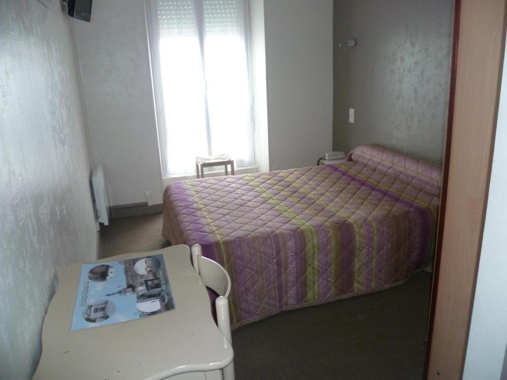 Postel nebo postele na pokoji v ubytování Hotel Du Port