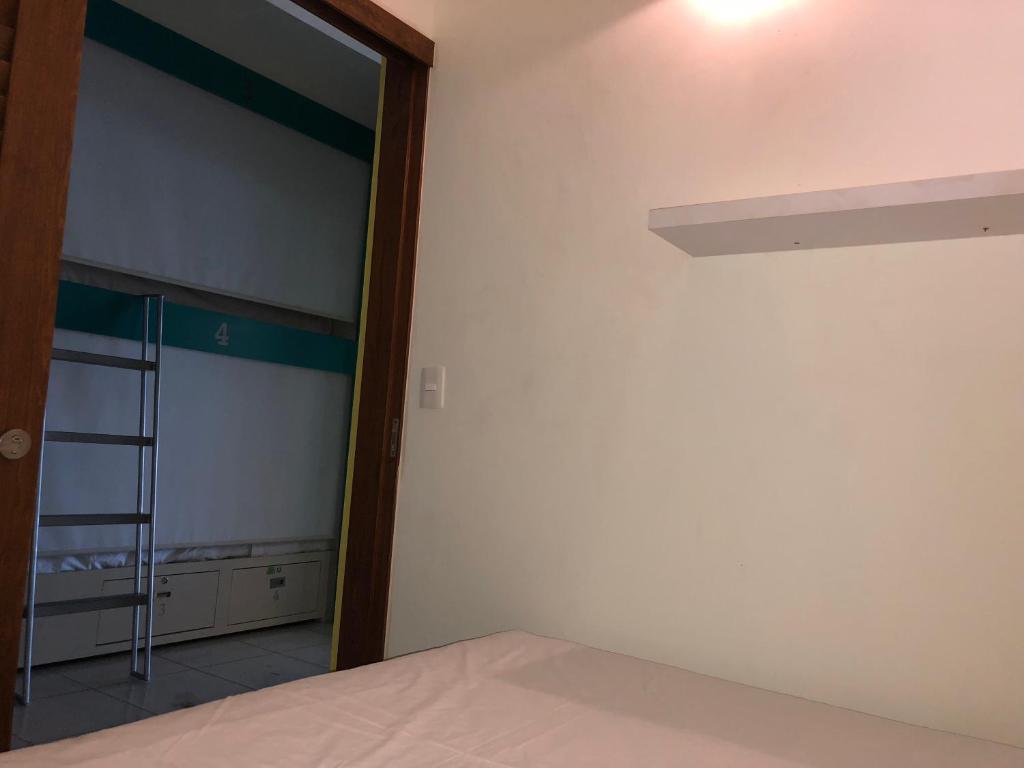 Postel nebo postele na pokoji v ubytování Hostel Frente al Mar Tropico 20º