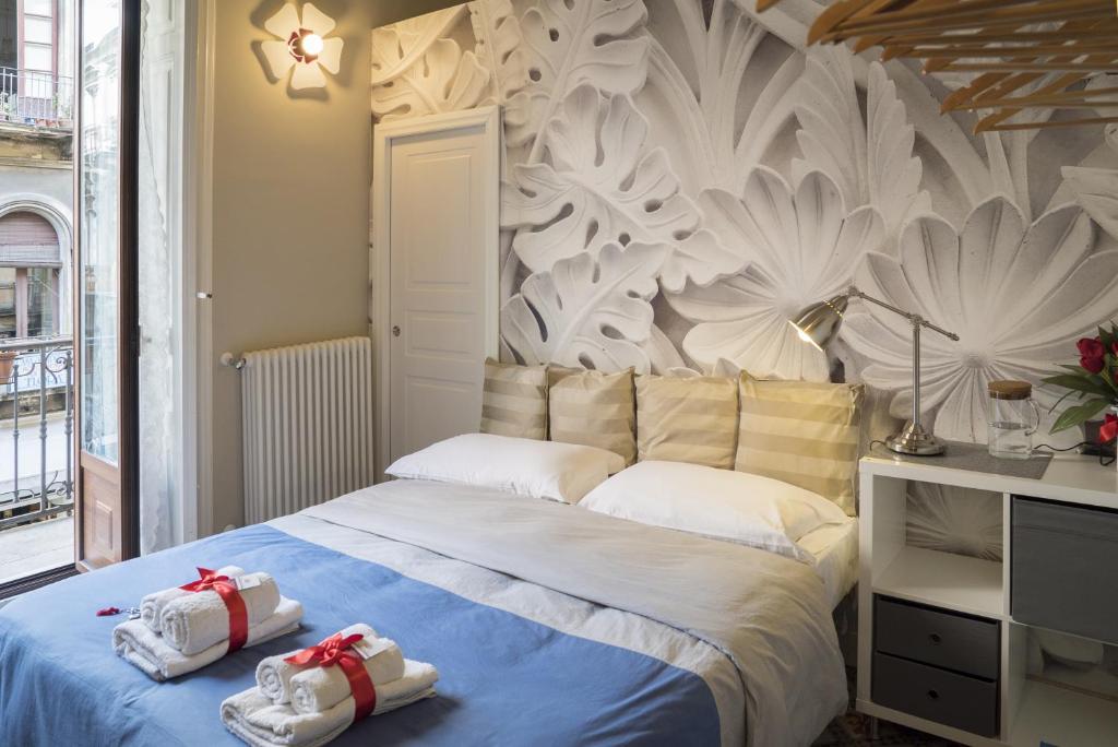 Posteľ alebo postele v izbe v ubytovaní RossoCorallo B&B