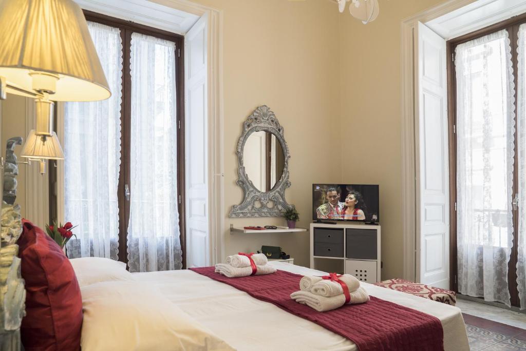 Posteľ alebo postele v izbe v ubytovaní RossoCorallo B&B