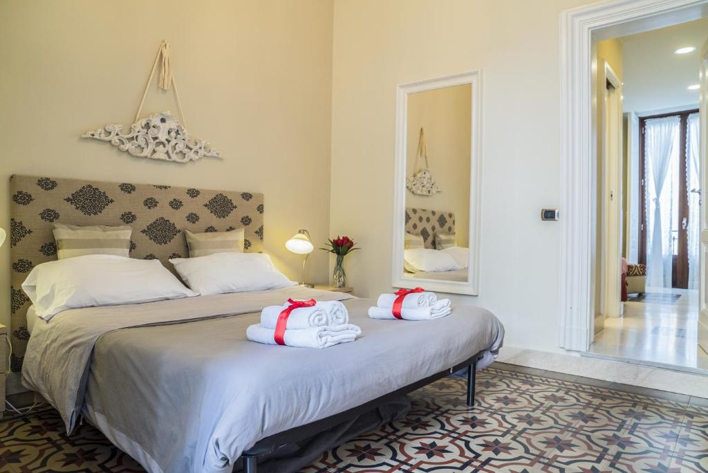 Posteľ alebo postele v izbe v ubytovaní RossoCorallo B&B