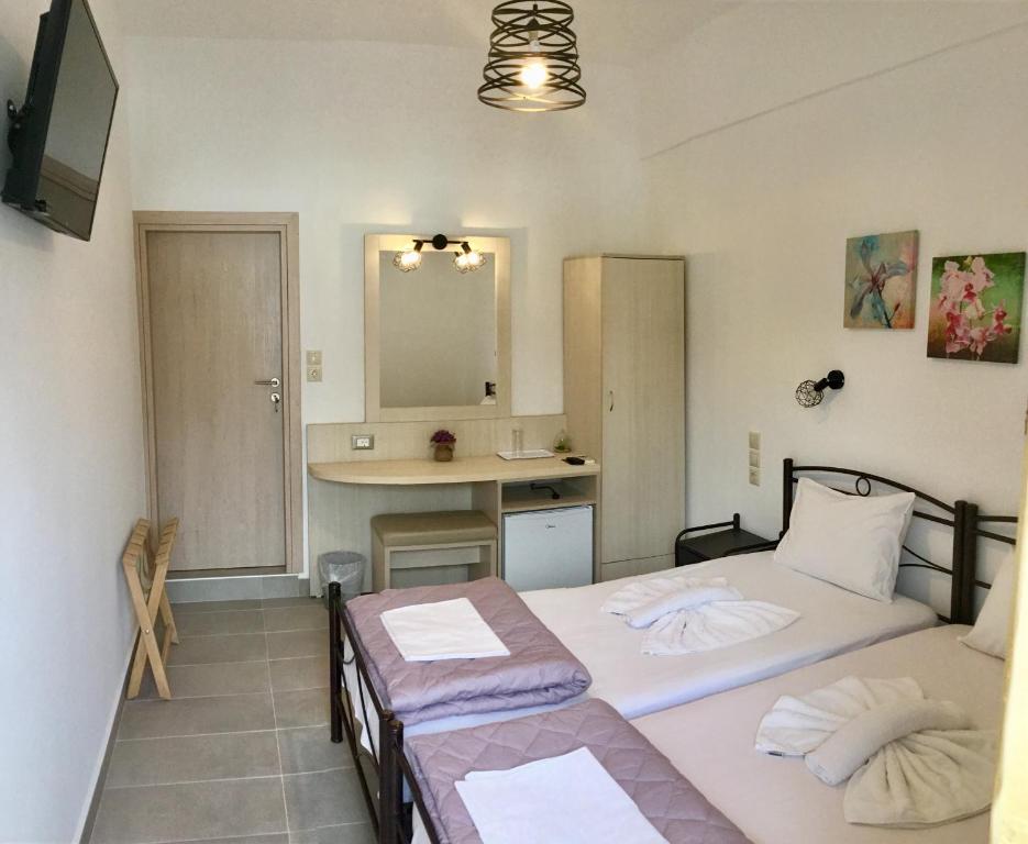 Posteľ alebo postele v izbe v ubytovaní Platanos Rooms