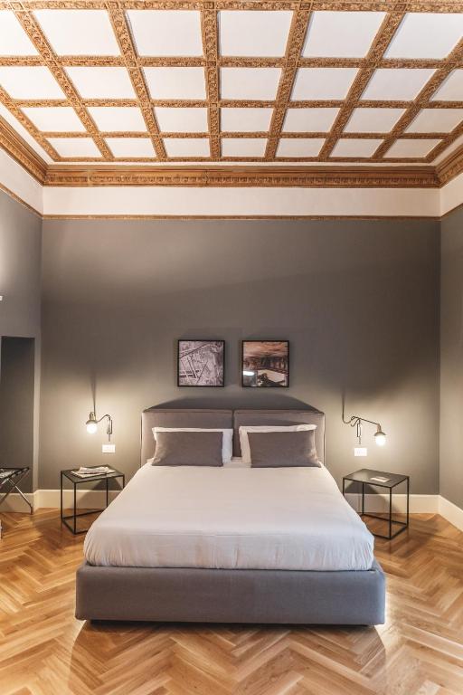 Postel nebo postele na pokoji v ubytování Relais Della Porta
