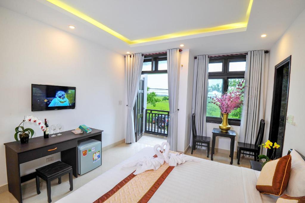 Postel nebo postele na pokoji v ubytování Hoi An Bali Homestay