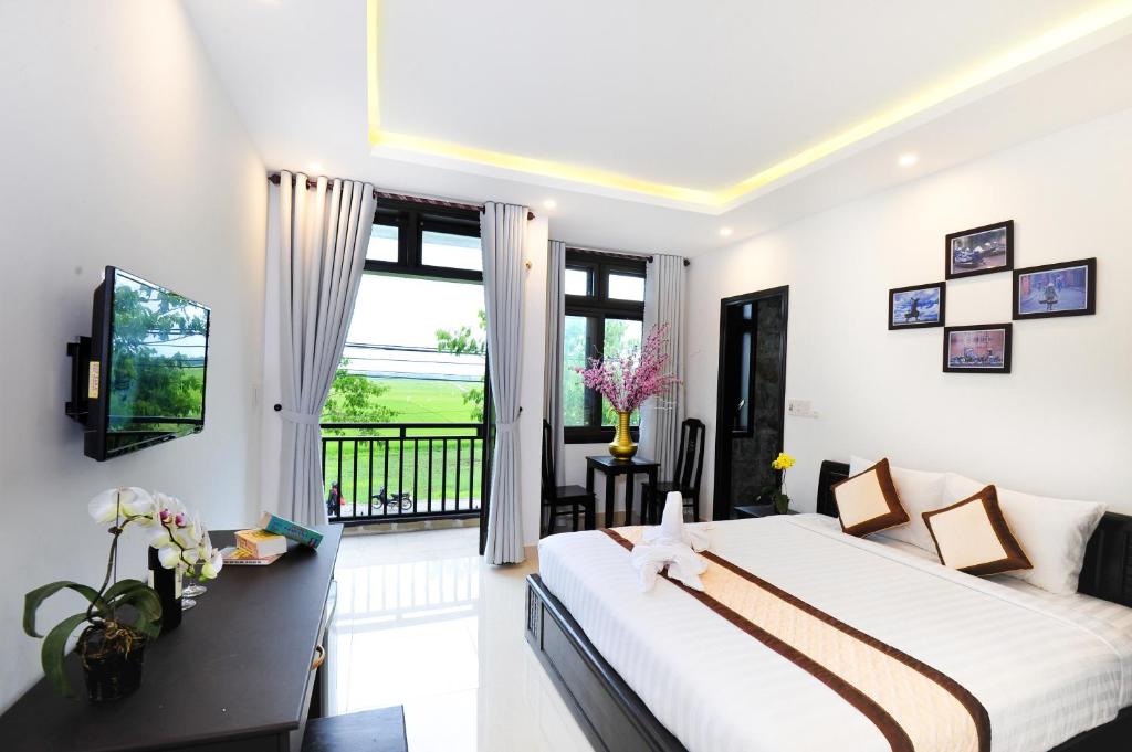 Postel nebo postele na pokoji v ubytování Hoi An Bali Homestay