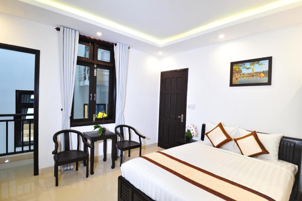 Postel nebo postele na pokoji v ubytování Hoi An Bali Homestay
