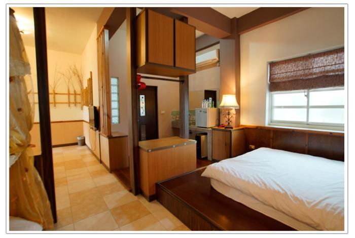 Postel nebo postele na pokoji v ubytování Xian Qing Yu Zhi Homestay