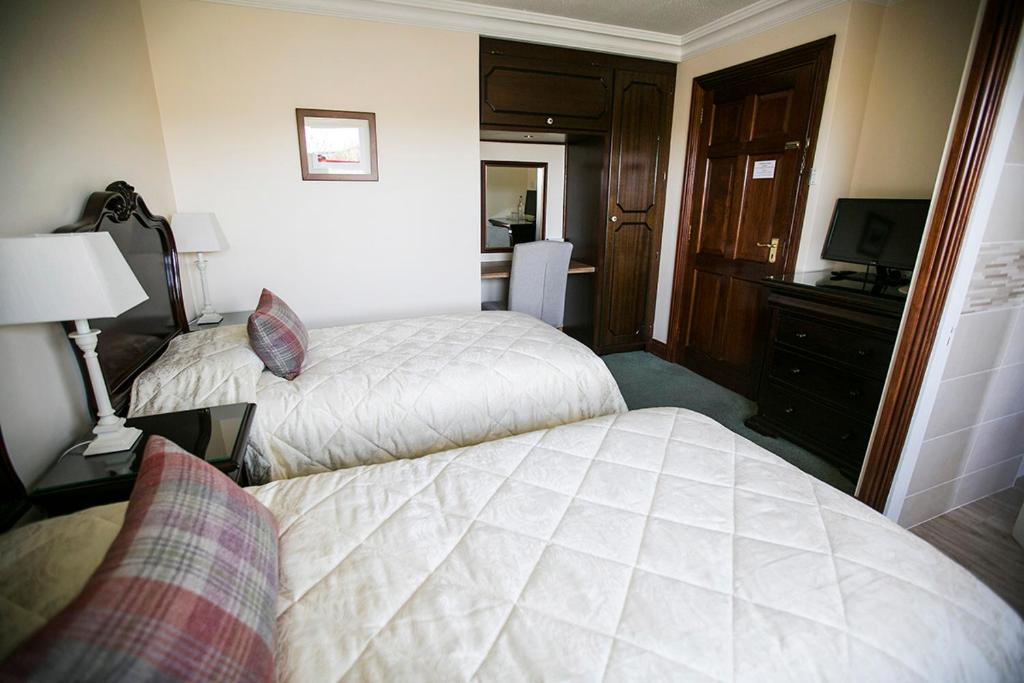 Letto o letti in una camera di Moloney House