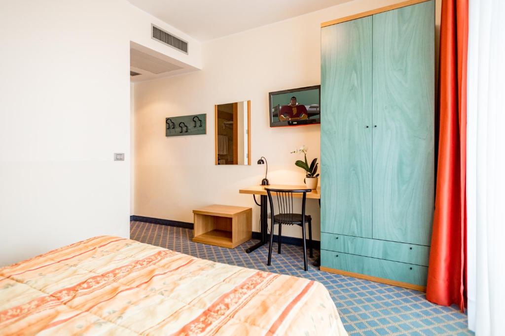 Postel nebo postele na pokoji v ubytování Hotel San Vito