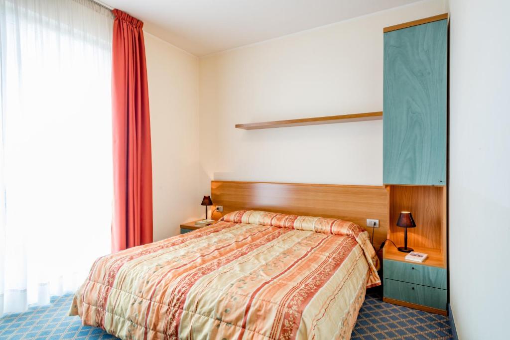 Postel nebo postele na pokoji v ubytování Hotel San Vito