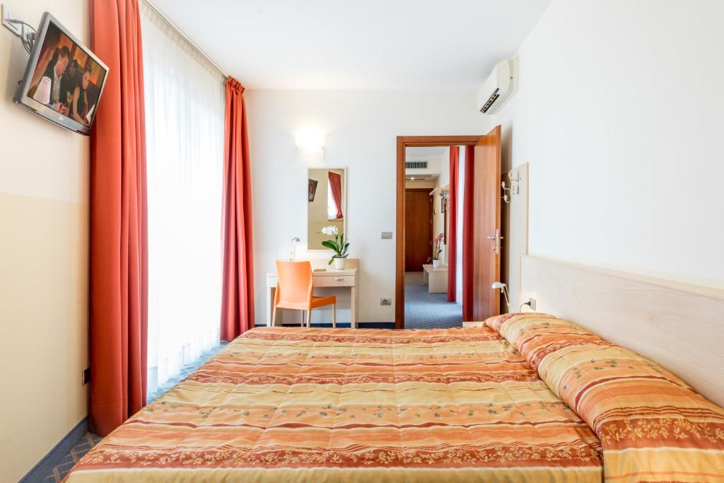 Postel nebo postele na pokoji v ubytování Hotel San Vito