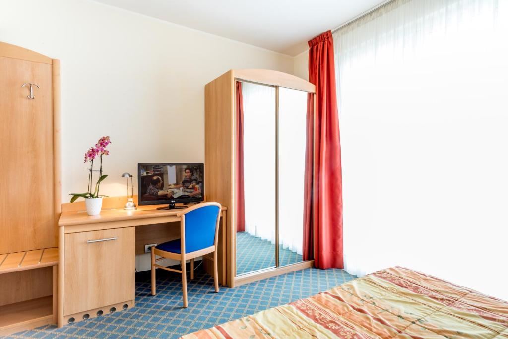 Postel nebo postele na pokoji v ubytování Hotel San Vito