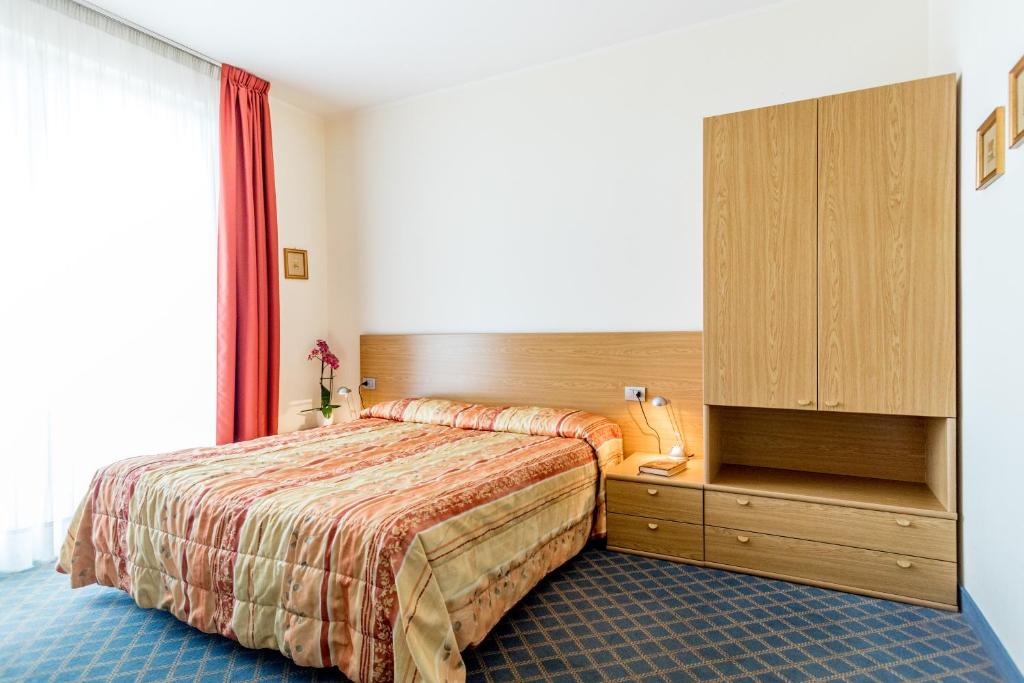 Postel nebo postele na pokoji v ubytování Hotel San Vito