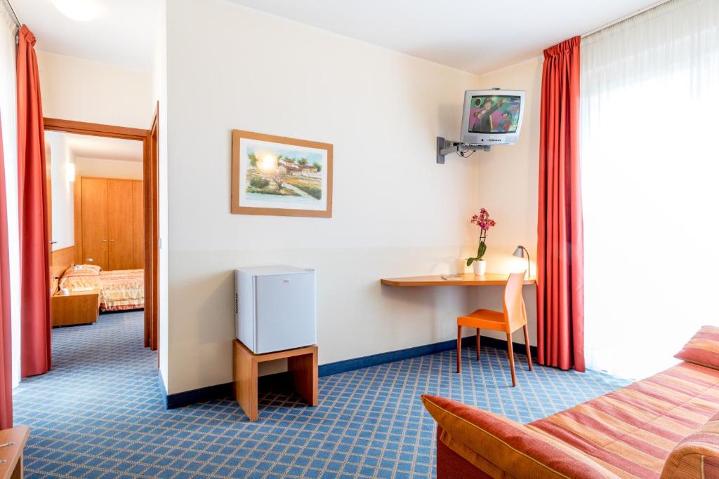 Postel nebo postele na pokoji v ubytování Hotel San Vito