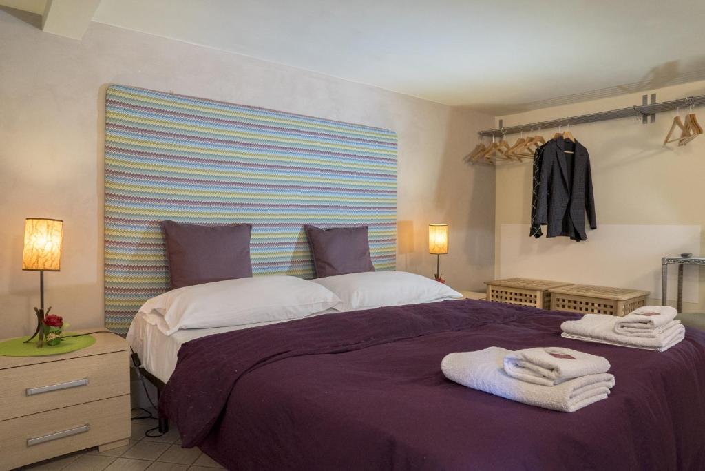 Posteľ alebo postele v izbe v ubytovaní RossoCorallo B&B