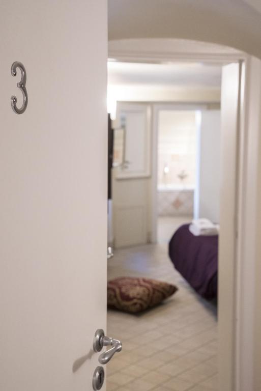 Posteľ alebo postele v izbe v ubytovaní RossoCorallo B&B