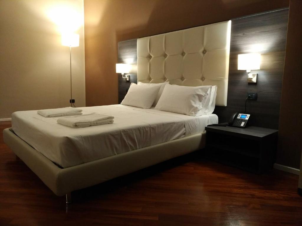 Posteľ alebo postele v izbe v ubytovaní Brain Rooms & Suite