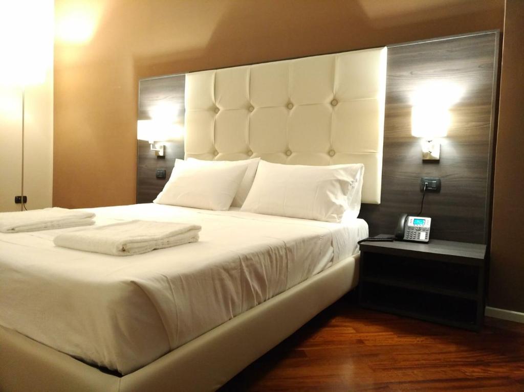 Posteľ alebo postele v izbe v ubytovaní Brain Rooms & Suite