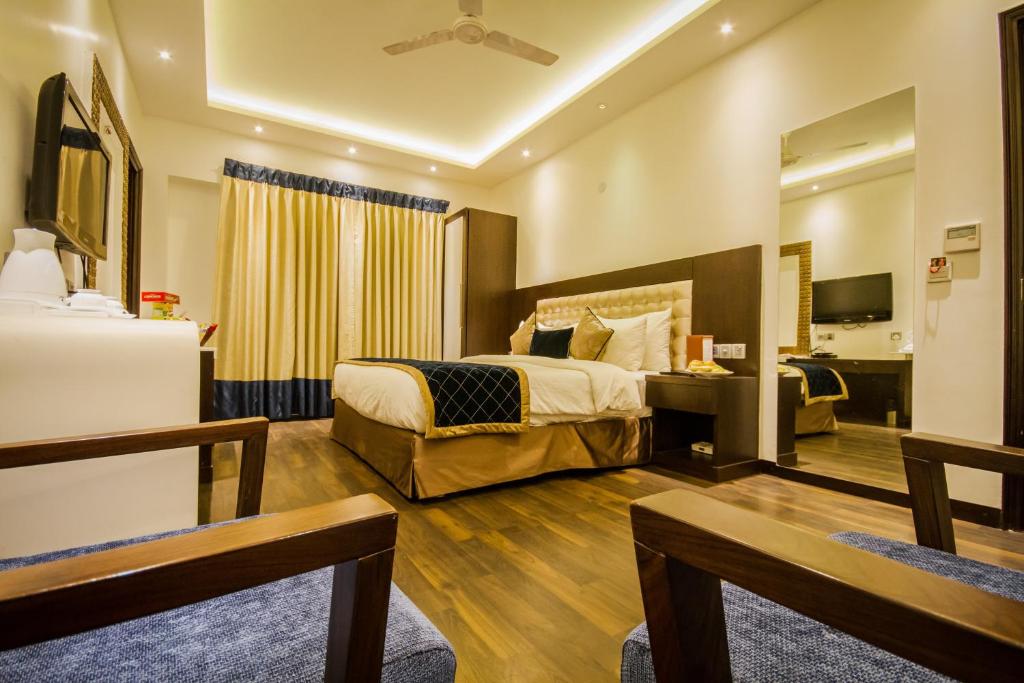 Postel nebo postele na pokoji v ubytování Hotel Grand Godwin Near New Delhi Railway Station